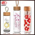 Wholesale hot selling 500ml slim glass water bottle, design branded drink bottles with design your own logo